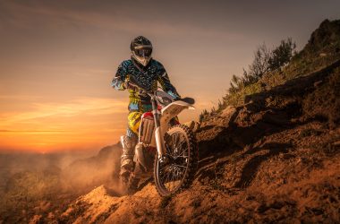 Man on a dirt bike wearing helmet.
